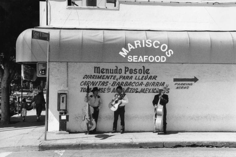 Mariscos seafood stand with street musicians