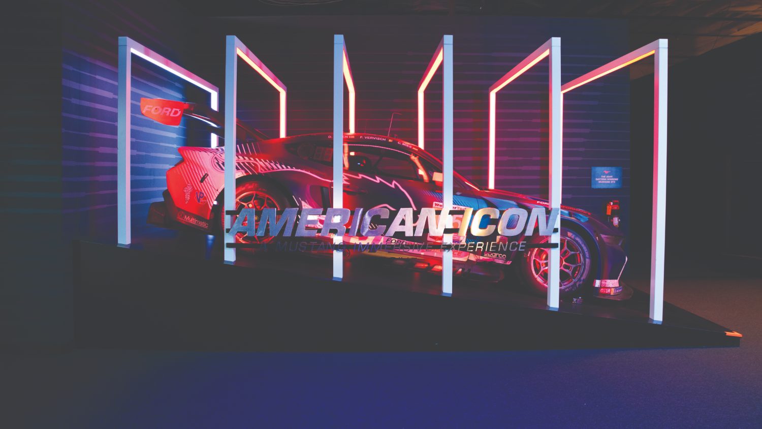 Ford American Icon exhibit — Mustang GT3 under lightbox colonnade
