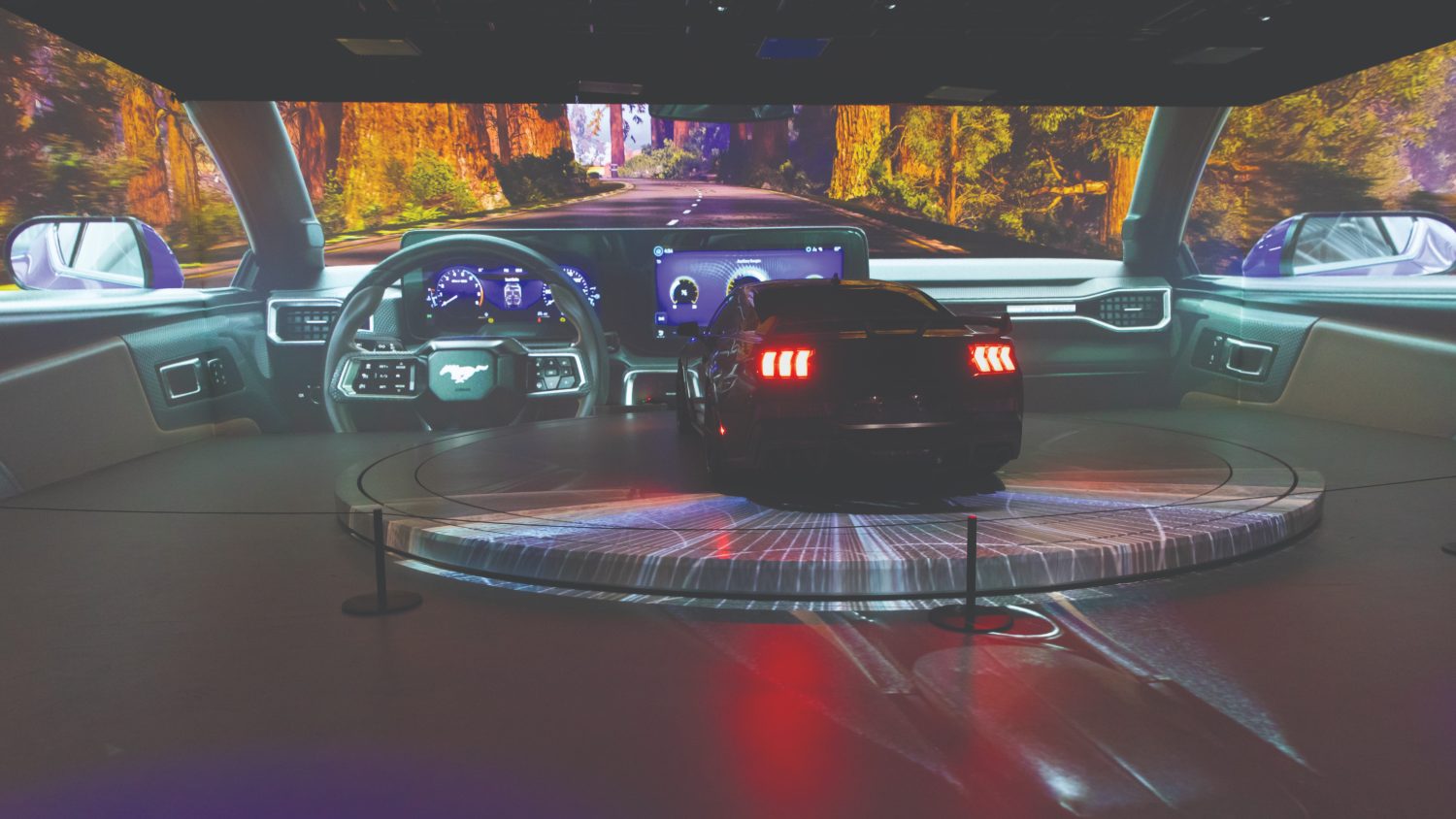 Projection-mapped drive room with Mustang on turntable