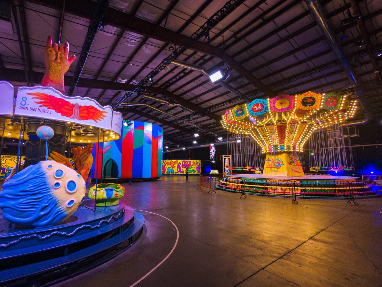 Luna Luna carousel and painted pavilions inside the hall